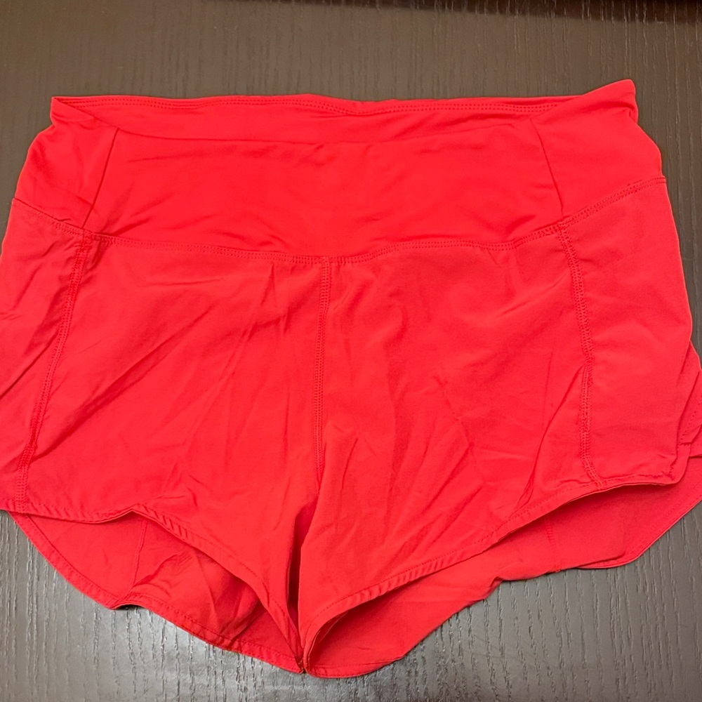Red running shorts
Approx size 8
